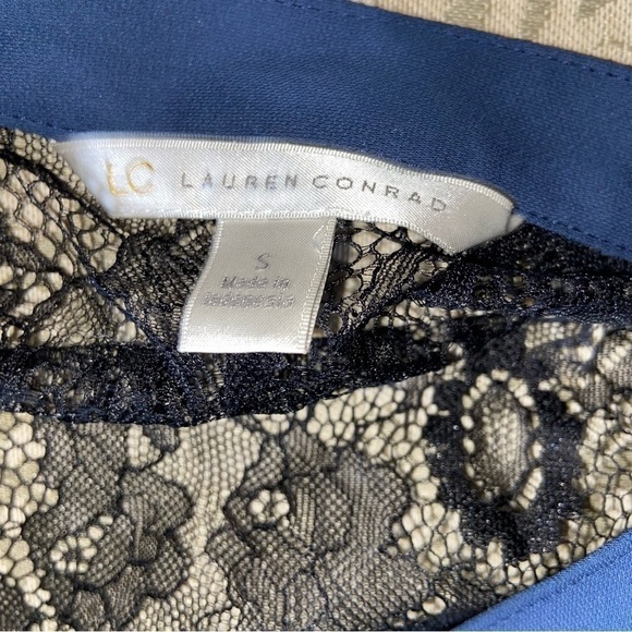 LAUREN Conrad classy navy blouse enhanced by lace shoulders and hidden buttons. - Picture 6 of 7